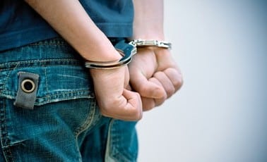 young man handcuffs 260nw 86474341 1 1