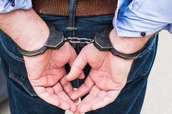 photo man handcuffs 260nw 430087495 1