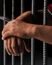 hands-prisoner-behind-prison-bars-260nw-2621840551 (2)