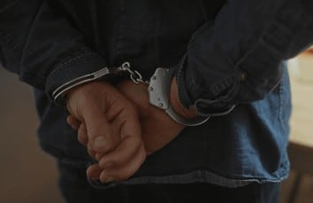 closeup-man-handcuffed-dimly-lit-260nw-2451425017 (2)